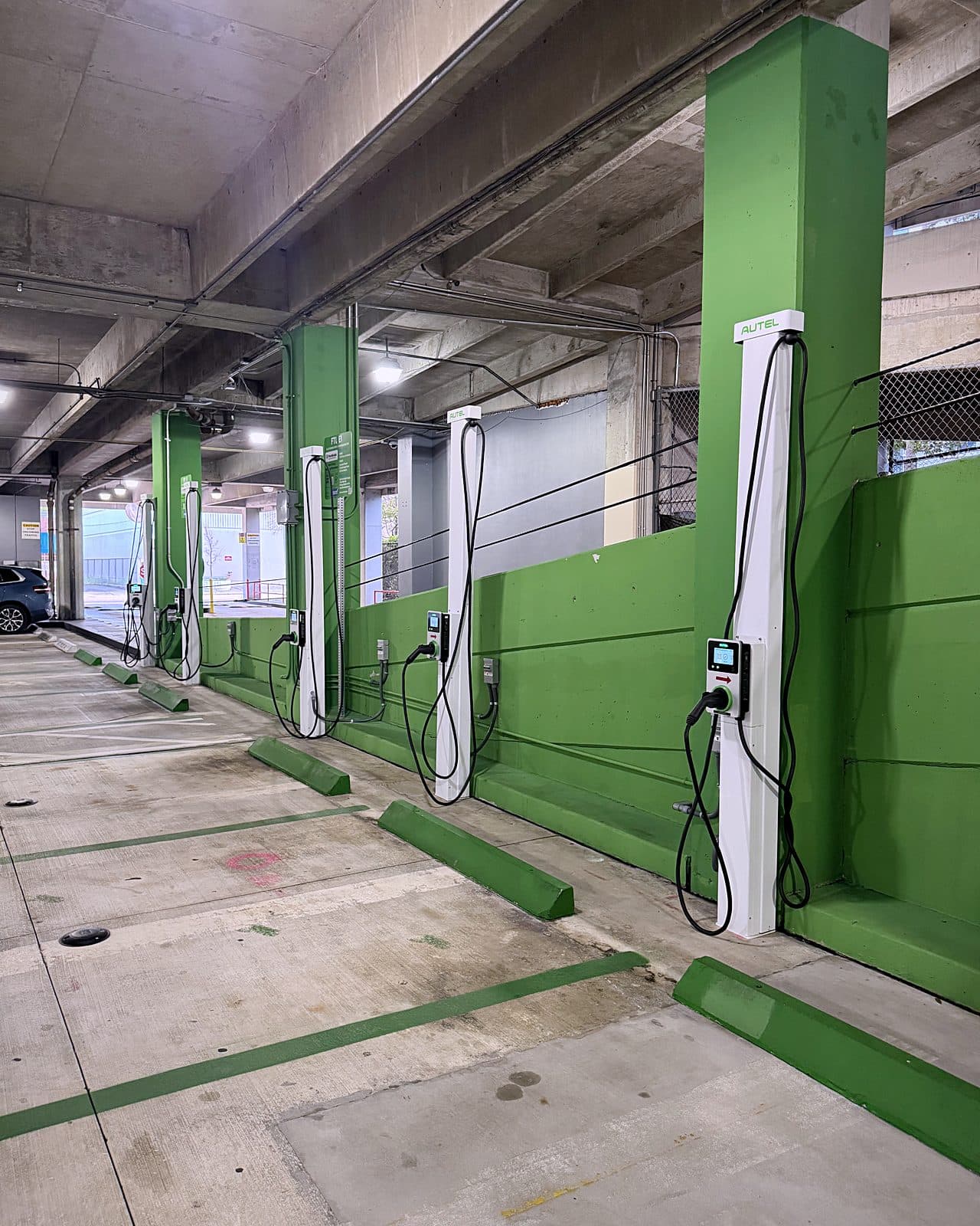 US Supercharge Level 2 chargers along a garage wall